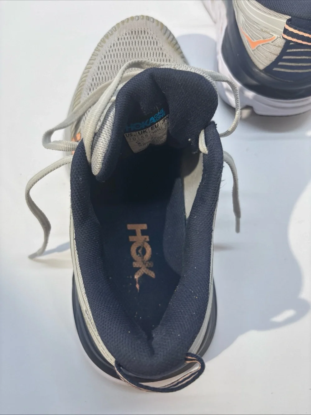 Hoka women’s size 7 gray/peach Bindi 7 style #110531 LRBI in fair condition.